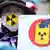 Женщина в маске протестует против сброса радиоактивной воды с АЭС "Фукусима"