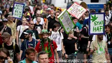 12.08.2023**Participants walk with placards during the annual Hemp Parade (Hanfparade), a demonstration for the legalization of hemp, near the Television Tower (Fernsehturm) in Berlin's centre on August 12, 2023. (Photo by Tobias SCHWARZ / AFP) (Photo by TOBIAS SCHWARZ/AFP via Getty Images)