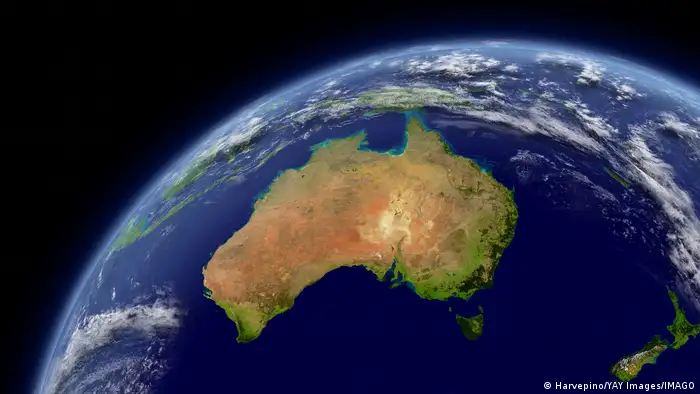 Australia viewed from space with atmosphere and clouds.