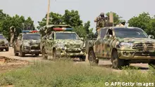 Nigerian soldiers patrol on October 12, 2019, after gunmen suspected of belonging to the Islamic State West Africa Province (ISWAP) group raided the village of Tungushe, killing a soldier and three residents. - Four civilians and three soldiers have been killed in attacks in northeastern Nigeria blamed on jihadist fighters, local residents and militias said on October 12, 2019. (Photo by - / AFP) (Photo by -/AFP via Getty Images)