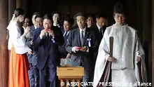 Japanese lawmakers are seen after their prayer to the war dead the Yasukuni Shrine in Tokyo, Tuesday, Aug. 15, 2023. Japan holds annual memorial service for the war dead as the country marks the 78th anniversary of its defeat in the World War II. (Kyodo News via AP)