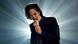 Australian singer Nick Cave singing at a concert in 2002, with a white light radiating behind him. Australian singer Nick Cave singing at a concert in 2002, with a white light radiating behind him.