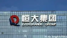 FILE PHOTO: The company logo is seen on the headquarters of China Evergrande Group in Shenzhen, Guangdong province, China September 26, 2021. REUTERS/Aly Song/File Photo