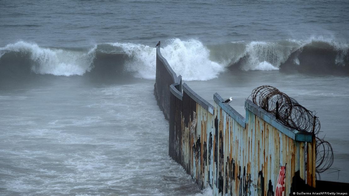 Large waves at the US-Mexico border wall
