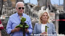 President Joe Biden and first lady Jill Biden participate in a blessing ceremony with the Lahaina elders at Moku'ula as they visit areas devastated by the Maui wildfires, Monday, Aug. 21, 2023, in Lahaina, Hawaii. (AP Photo/Evan Vucci)