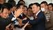 Former Thai Prime Minister Thaksin Shinawatra greets his supporters after landing at Bangkok's Don Mueang airport Former Thai Prime Minister Thaksin Shinawatra greets his supporters after landing at Bangkok's Don Mueang airport
