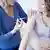 A woman getting a vaccination.