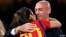 EDITORS NOTE: Graphic content / Spain's defender #20 Rocio Galvez (L) is congratuled by President of the Royal Spanish Football Federation Luis Rubiales (R) after winning the Australia and New Zealand 2023 Women's World Cup final football match between Spain and England at Stadium Australia in Sydney on August 20, 2023. (Photo by FRANCK FIFE / AFP)