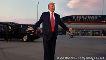 ATLANTA, GEORGIA - AUGUST 24: Former U.S. President Donald Trump speaks to the media at Atlanta Hartsfield-Jackson International Airport after surrendering at the Fulton County jail on August 24, 2023 in Atlanta, Georgia. Trump was booked on multiple charges related to an alleged plan to overturn the results of the 2020 presidential election in Georgia. Joe Raedle/Getty Images/AFP (Photo by JOE RAEDLE / GETTY IMAGES NORTH AMERICA / Getty Images via AFP)