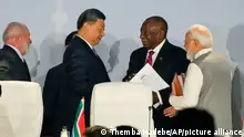South African President Cyril Ramaphosa, centre right speaks to China's President Xi Jinping as President of Brazil Luiz Inacio Lula, left, and Prime Minister of India Narendra Modi look on, at the BRICS summit in Johannesburg, South Africa, Thursday, Aug. 24, 2023. (AP Photo/Themba Hadebe)