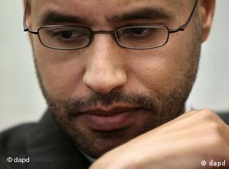 Saif al-Islam holding a press