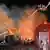 Firefighters work to put out fire at gas station in Crevedia, southeastern Romania