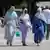  Young women of the Muslim faith stroll in the Parc Borély in Marseille on July 26, 2023.
