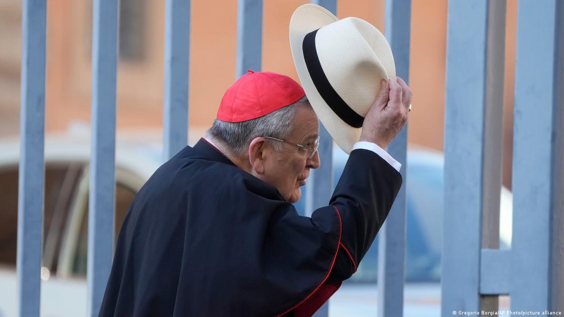 Cardinal Raymond Leo Burke waves to Swiss Guards as he arrives at the Vatican, for a meeting with other Cardinals to discuss Pope's apostolic constitution reforming the Vatican Bureaucracy, Monday, Aug. 29, 2022.