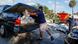 People load sandbags onto a car as they prepare for the impact of Tropical Storm Idalia, due to hit Wednesday People load sandbags onto a car as they prepare for the impact of Tropical Storm Idalia, due to hit Wednesday