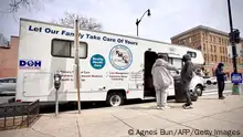 Tyrone Pinkney, needle exchange specialist at Family and Medical Counselling Service Inc (FMCS), talks to a man outside the FMCS van in Washington, DC, on April 21, 2022. - Several organizations are trying to fight the damages caused by fentanyl, an ultra-powerful and addictive synthetic opioid, in the US capital. In 2021, 95% of the city's fatal opioid overdoses were fentanyl-related, and 85% were Black people. (Photo by Agnes BUN / AFP) (Photo by AGNES BUN/AFP via Getty Images)