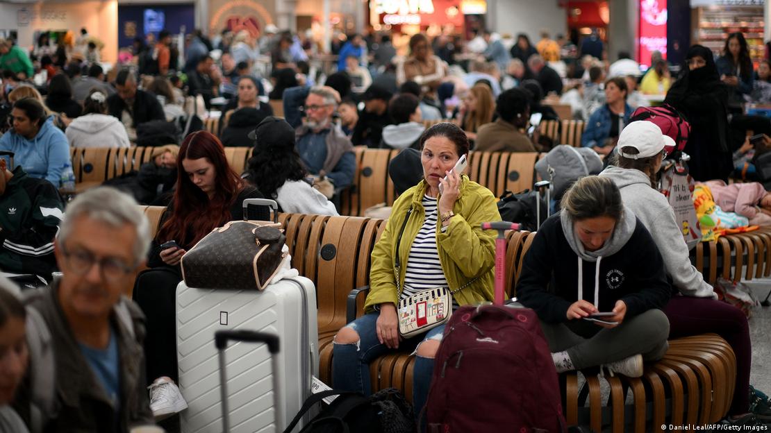Passengers waiting at London's Stansted Airport on Tuesday