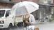 A woman holds an umbrella in heavy rain after Typhoon Saola moves away in Taipei, Taiwan, Thursday, Aug. 31, 2023. A woman holds an umbrella in heavy rain after Typhoon Saola moves away in Taipei, Taiwan, Thursday, Aug. 31, 2023.