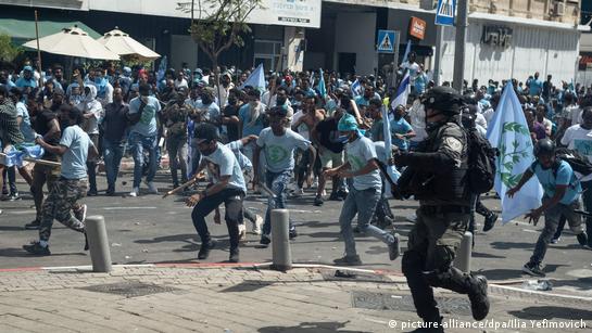 Eritrean asylum seekers clash with police during a demonstration in Tel Aviv