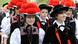 A group of teenagers dressed in traditional Black Forest clothing A group of teenagers dressed in traditional Black Forest clothing
