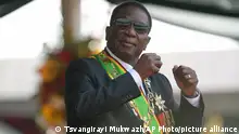 Zimbabwe President Emmerson Mnangagwa gestures during his inauguration ceremony at the National Sports Stadium in the capital, Harare, Monday, Sept. 4 2023. Mnangagwa won a second and final-five year term in another disputed poll in the politically and economic troubled southern African nation. (AP Photo /Tsvangirayi Mukwazhi)