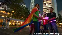 HONG KONG, HONG KONG - MAY 17: LGBT supporters hold glow sticks as they take part in a gathering for International Day Against Homophobia on May 17, 2019 in Hong Kong, China. Taiwan's parliament became the first in Asia to legalize same-sex marriage after lawmakers voted on Friday to allow same-sex couples full legal marriage rights, including areas in taxes, insurance and child custody.(Photo by Anthony Kwan/Getty Images)