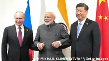 Russian President Vladimir Putin, Indian Prime Minister Narendra Modi and Chinese President Xi Jinping hold a meeting on the sidelines of the G20 summit in Osaka on June 28, 2019. (Photo by Mikhail KLIMENTYEV / SPUTNIK / AFP) (Photo credit should read MIKHAIL KLIMENTYEV/AFP via Getty Images)