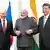 رئيس الوزراء الهندي الهندي رانيندرا مودي يتوسط نظيريه الصيني شي جينبينغ والروسي فلادمير بوتين (أوساكا اليابانية، يونيو 2019)