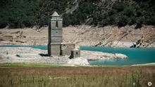 The ruins of the Church of Asuncion of Mediano, normally submerged almost entirely in the waters of the Mediano reservoir, are now visible on solid ground due to the ongoing drought that has caused the reservoir to be at 25.5% of its capacity, on July 26, 2023 in Mediano, Huesca province. (Photo by ANDER GILLENEA / AFP) (Photo by ANDER GILLENEA/AFP via Getty Images)