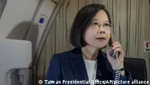 CORRECTS SPELLING OF ESWATINI In this photo released by the Taiwan Presidential Office, Taiwan's President Tsai Ing-wen speaks on the intercom system on a plane as she leaves for a visit to Eswatini from Taiwan Tuesday, Sept. 5, 2023. Taiwan's President Tsai Ing-wen has begun a four-day trip to Eswatini, one of the island's 13 remaining allies. Tsai, who is serving her last year as president, is visiting the country of 1.1 million people in southern Africa to celebrate the friendship between the two countries, she said, as she departed Taiwan. (Taiwan Presidential Office via AP)