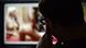 The back of a man's head as he looks at pornography on a blurred screen The back of a man's head as he looks at pornography on a blurred screen