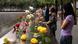 People lay flowers at a 9/11 Memorial in New York.