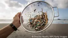 14/07/2018 **A volunteer of the NGO 'Canarias Libre de Plasticos' (Canary Islands free of plastics) carries out a collection of microplastics and mesoplastic debris to clean the Almaciga Beach, on the north coast of the Canary Island of Tenerife, on July 14, 2018. (Photo by DESIREE MARTIN / AFP) (Photo credit should read DESIREE MARTIN/AFP via Getty Images)