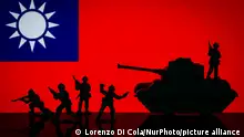 April 13, 2023**Illustration with figures of soldiers and a tank in front of a Taiwan flag displayed on a computer screen is seen in L'Aquila, Italy, on april 13, 2023. (Photo by Lorenzo Di Cola/NurPhoto)