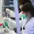 Lab workers analyze coronavirus tests