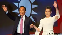 Terry Gou (L), founder and former chairman of Foxconn and independent Taiwanese presidential candidate, joins his hand with his running mate Lai Pei-hsia during a press conference in Taipei on September 14, 2023. (Photo by Sam Yeh / AFP)