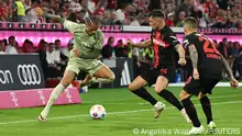 15/09/2023**Soccer Football - Bundesliga - Bayern Munich v Bayer Leverkusen - Allianz Arena, Munich, Germany - September 15, 2023
Bayern Munich's Leroy Sane in action with Bayer Leverkusen's Granit Xhaka and Alejandro Grimaldo REUTERS/Angelika Warmuth DFL REGULATIONS PROHIBIT ANY USE OF PHOTOGRAPHS AS IMAGE SEQUENCES AND/OR QUASI-VIDEO.