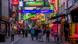 A busy street in Hamburg's red-light district with bright neon signs can be seen A busy street in Hamburg's red-light district with bright neon signs can be seen