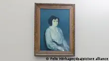 Picture of a painting titled Madame Soler by artist Pablo Picasso hangs on a white wall.