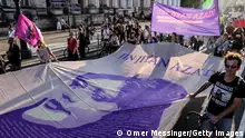 BERLIN, GERMANY - SEPTEMBER 16: Protesters hold a giant banner bearing the names of people who were killed in the passing year including this of Jina Mahsa Amini, as people gather to commemorate the first anniversary of her death on September 16, 2023 in Berlin, Germany. Amini, 22 years old of Kurdish decent, was arrested by Iranian authorities in Tehran on September 13, 2022, for not wearing her headscarf properly and died three days afterwards due to a severe head injury. Her death sparked demonstrations across Iran that spiraled into violence and have resulted in executions, hundreds of other deaths and thousands of arrests following severe government crackdowns. (Photo by Omer Messinger/Getty Images)