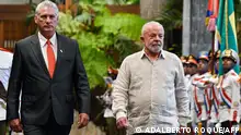 Cuba's President Miguel Diaz-Canel (L) and Brazil's President Luiz Inacio Lula da Silva receive honours during the welcoming ceremony at Revolution Palace of Havana, on September 16, 2023. Lula arrived in Cuba on Friday to participate in the two-day G77+China, a group of developing and emerging countries representing 80 percent of the world's population. (Photo by Adalberto ROQUE / AFP)