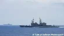 This undated handout photo released by the Taiwan Defense Ministry on September 13, 2023 shows Chinese aircraft carrier Shandong (L) while being monitored by a Taiwanese Keelung class warship at sea. Taiwan said on September 13 it had detected 35 Chinese warplanes around the island in a few hours, with some flying to the Western Pacific to join China's Shandong aircraft carrier for a joint sea and air training. (Photo by Handout / Taiwan Defense Ministry / AFP) / RESTRICTED TO EDITORIAL USE - MANDATORY CREDIT AFP PHOTO / TAIWAN DEFENSE MINISTRY - NO MARKETING NO ADVERTISING CAMPAIGNS - DISTRIBUTED AS A SERVICE TO CLIENTS