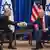 Izraelski premijer Benjamin Netanjahu i američki predsjednik Joe Biden sjede i rukuju se