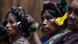 Picture of inidgenous women with headphones on at a court trial. Picture of inidgenous women with headphones on at a court trial.