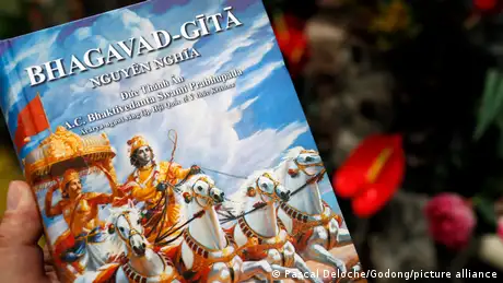 Picture of a book cover featuring Vietnamese script and the romanized words Bhagavad Gita - which is a Hindu text. 