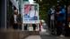 People walk past an election poster showing Jörg Prophet in Nordhausen People walk past an election poster showing Jörg Prophet in Nordhausen