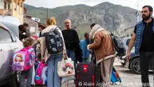 25/09/2023 *** Refugees load their cars as they leave the Red Cross registration center, in Goris, on September 25, 2023. The first group of Nagorno-Karabakh refugees since Azerbaijan's lighting assault against the separatist region entered Armenia on September 24, 2023, an AFP team at the border said. The group of a few dozen people passed by Azerbaijani border guards before entering the Armenian village of Kornidzor, where they were registered by officials from Armenia's foreign ministry. (Photo by ALAIN JOCARD / AFP) (Photo by ALAIN JOCARD/AFP via Getty Images)