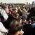 Mourners react during the funeral of victims of the fatal fire of a wedding celebration, in Hamdaniya, Iraq, September 27, 2023.