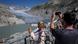 people photographing a glacier people photographing a glacier