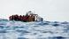 Crew members of the Geo Barents migrant rescue ship, operated by Medecins Sans Frontieres (Doctors Without Borders), distribute life jackets to a group of 61 migrants on a wooden boat during a rescue operation Crew members of the Geo Barents migrant rescue ship, operated by Medecins Sans Frontieres (Doctors Without Borders), distribute life jackets to a group of 61 migrants on a wooden boat during a rescue operation